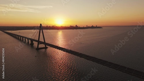 Drone flying over the San Roque González de Santa Cruz International Bridge at sunset. Argentina-Paraguay photo