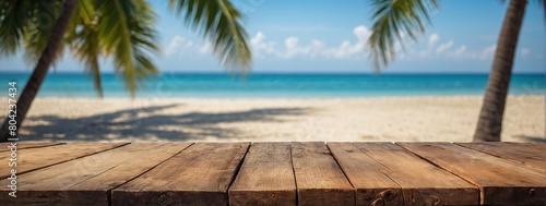 Top of wood table with seascape and palm leaves, blur bokeh light of calm sea and sky at tropical beach background, Empty ready for your product display montage, summer vacation background concept