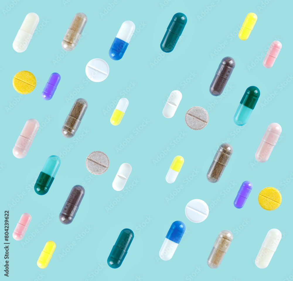 Seamless pattern of different colorful pills on soft blue background. Seamless pattern of different colorful pills on soft blue background.