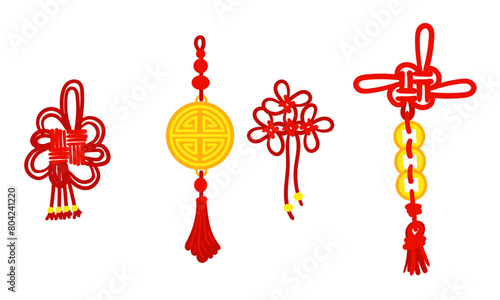 Set of red threads tied in Chinese knots for good luck, symbolizing good luck and prosperity. Red threads, knots, gold coins, an amulet. Materials in the traditional Asian style decoration in cultural