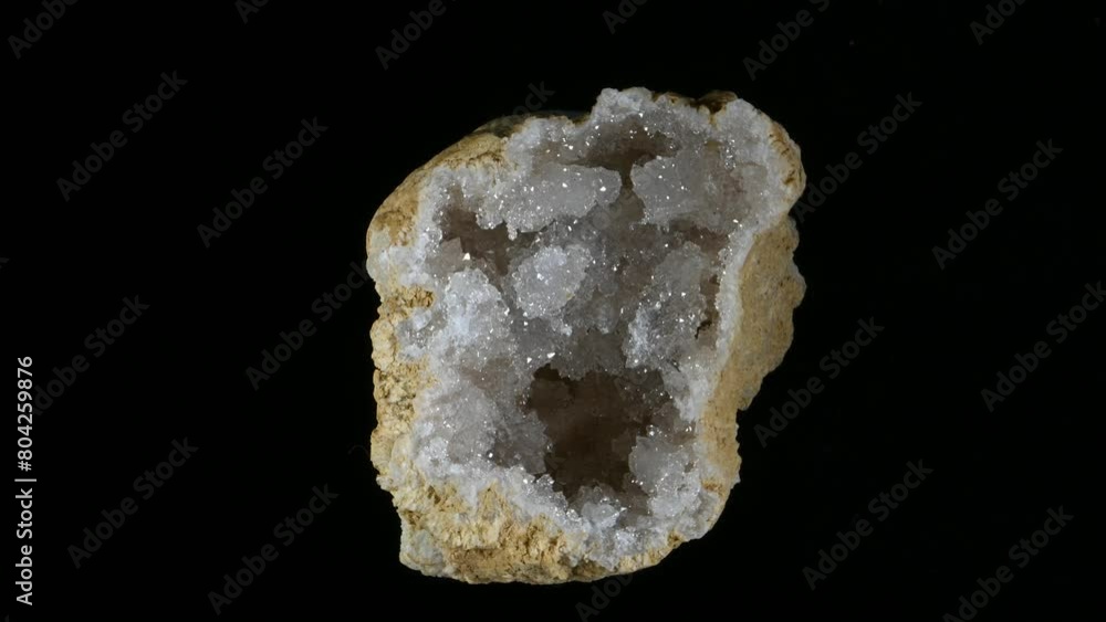 Geode containing quartz crystals, rotating slowly against a black background (Mendip, Somerset, UK) Geode containing quartz crystals, rotating slowly against a black background (Mendip, Somerset, UK)