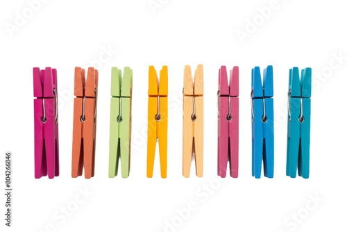 Symphony of Colors: A Vibrant Lineup of Clothes Pins. On a White or Clear Surface PNG Transparent Background.