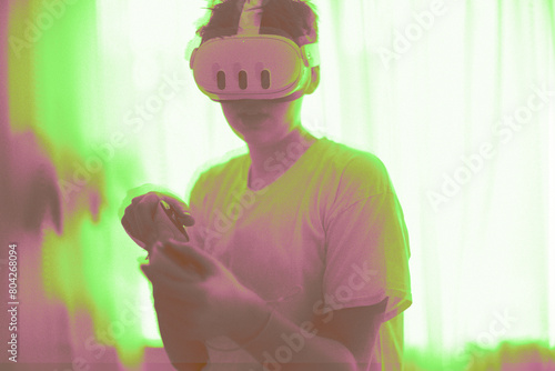 Teenage boy playing Meta Quest 3. Copy space. Glitch effect background. © malgo_walko