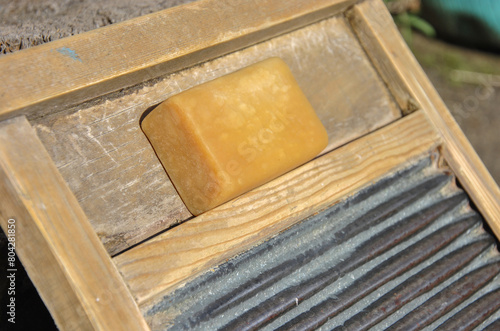 laundry soap on an old washing board for hand washing. selective focus photo