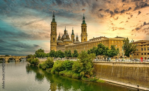 Iconic View of Zaragoza's Cathedral and Waterfront at Sunset photo