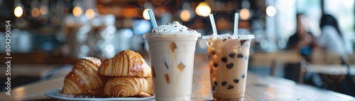 Close-up of croissants and iced coffee on a table in a coffee shop photo