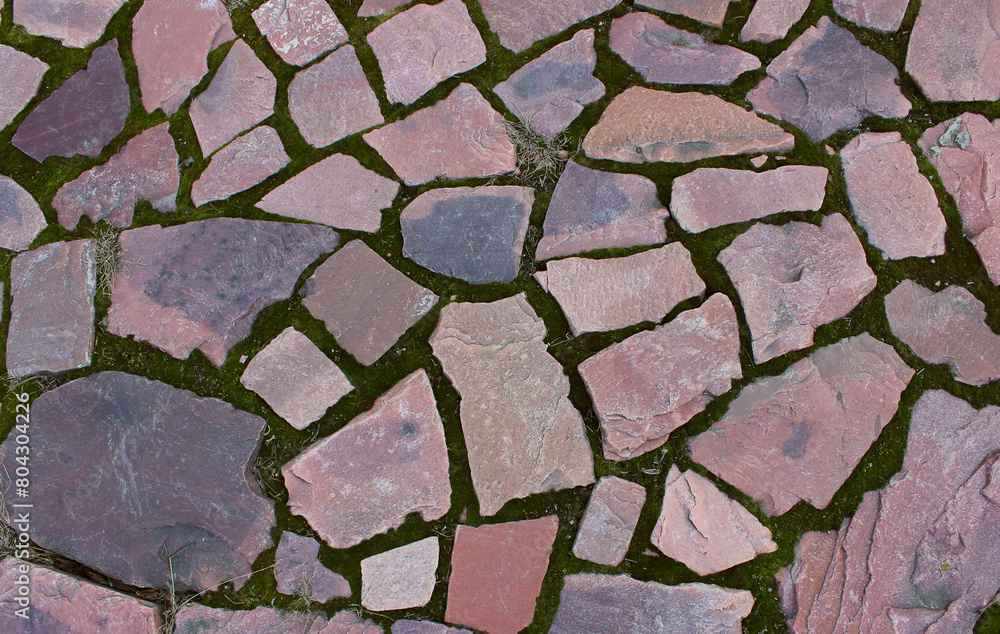 Obraz premium Ancient walking path paved with red granite with straight edges 