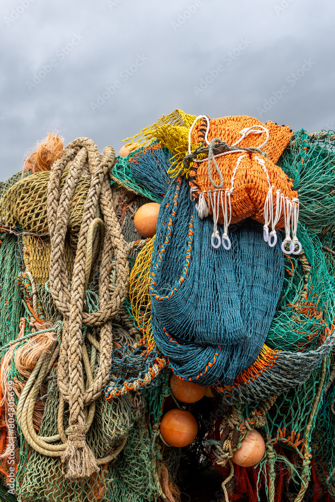 Fishing nets and ropes piled up at a harbour in Dorset Fishing nets and ropes piled up at a harbour in Dorset