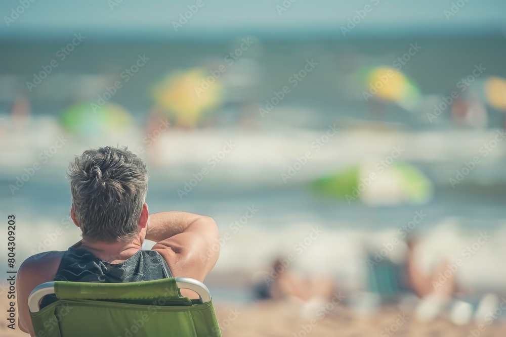 Fototapeta premium Man relaxing at the beach