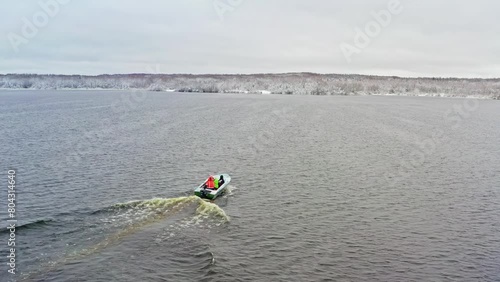 Fishermen Navigating Fish Farm Cages. Aerial drone shot
