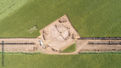 Aerial view of gas and oil pipeline construction and archeological excavations. Big pipeline is under construction.