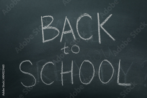 Chalk writing on the blackboard: "Back to school"