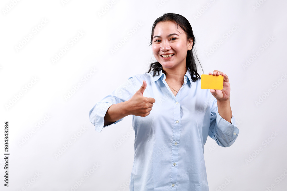 Young asian woman in formal clothes showing blank card and thumb up gesture, approve and recommend, smiling at camera, white background Young asian woman in formal clothes showing blank card and thumb up gesture, approve and recommend, smiling at camera, white background