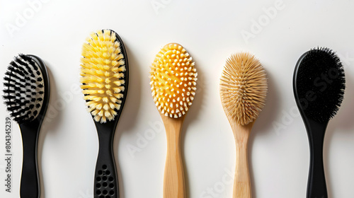 Different massage brushes on white background photo
