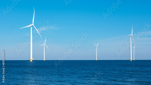 A majestic row of wind turbines rises from the ocean in the Netherlands Flevoland, harnessing the power of the wind to generate clean energy