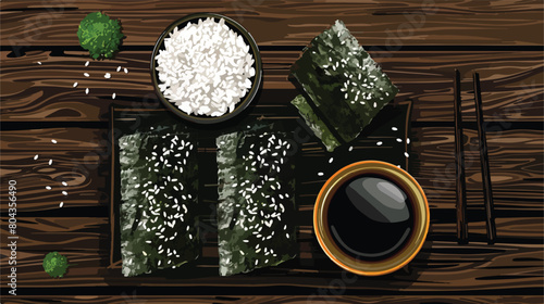 Board with nori sheets rice sesame seeds and sauce 