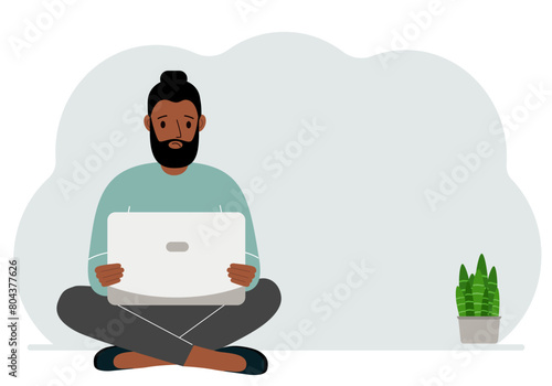 A man sits cross-legged in his hands holding a laptop. The concept of work, education, reading, watching videos. Vector flat illustration