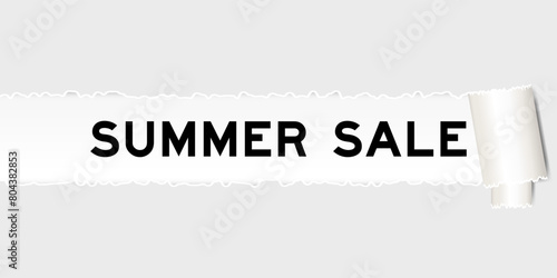 Ripped gray paper background that have word summer sale under torn part