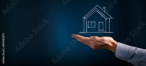 A real estate agent hand holding up an outline of a house