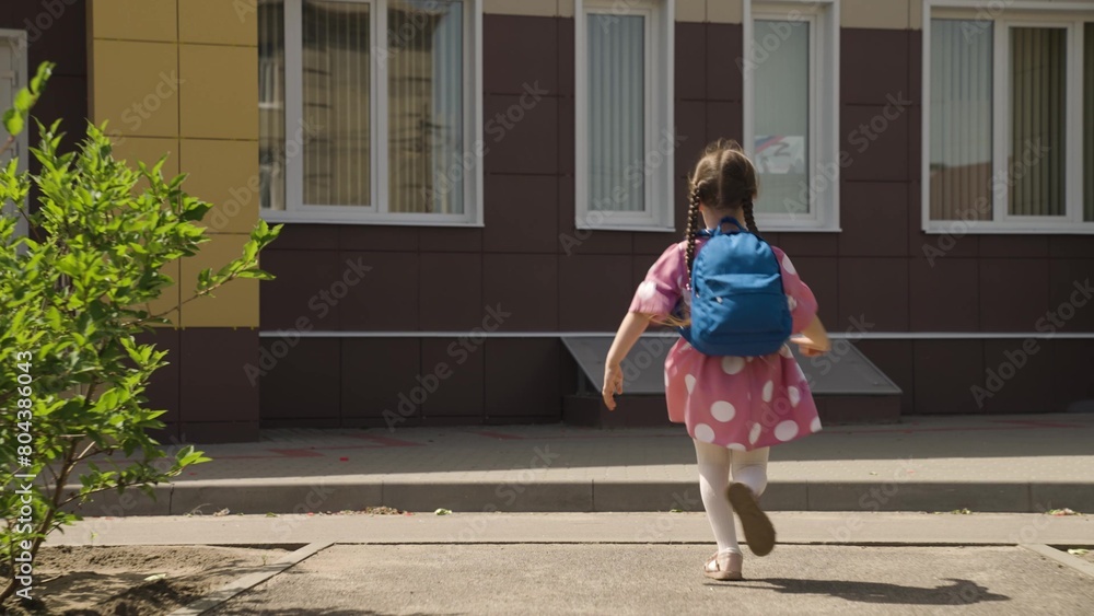 child kid girl daughter running school backpack, returning from school from lessons, children education school yard house running leg, carefree kid joy, kid enjoying outdoors, jumping child happiness