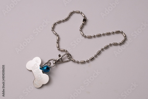a cat and dog's name tag necklace
