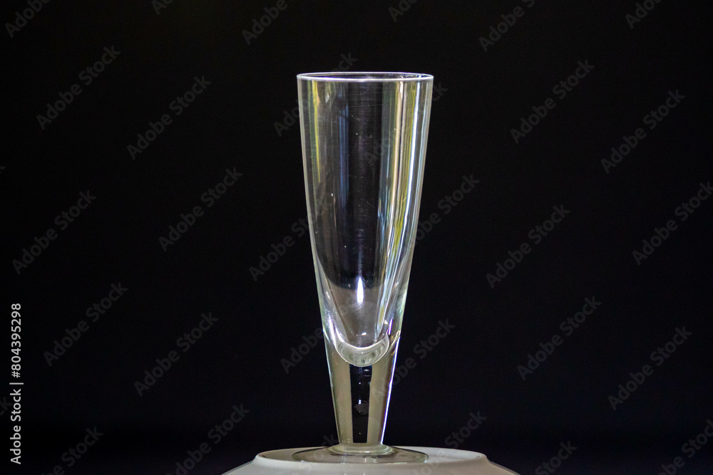 Traditional empty crystal glass for beer isolated on black background and selective focus Traditional empty crystal glass for beer isolated on black background and selective focus