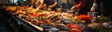A beautiful display of fresh seafood on ice at a bustling market.