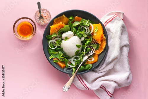 Burrata is a Pulian Italian cheese with a creamy base and a salad of red Sicilian oranges. Summer Italian cuisine, Puglia recipes, summer vitamims food. Summer lunch ideas, white  table