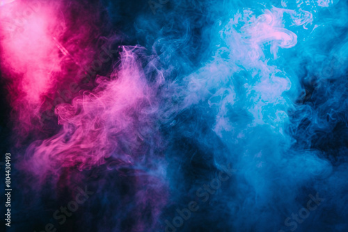 Electric blue smoke abstract background on a stage under a coral pink spotlight, creating a pop of color against a dark grey backdrop.