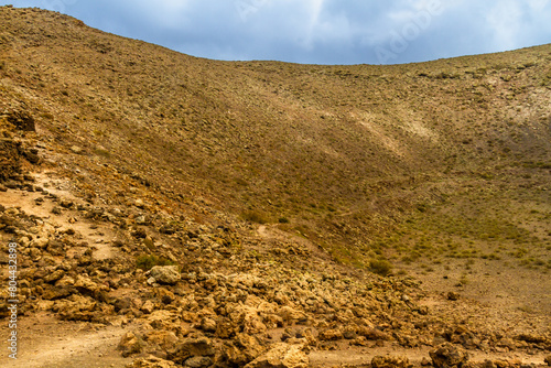 Hiking trail to Caldera Blanca. Interior the La Calderata ( Montana Calderata ) volcano. Los Volcanes Natural Park, Lanzarote, Canary Islands, Spain photo