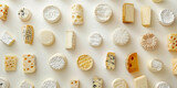 Assorted Types of Cheeses Arranged on White Surface with White Background
