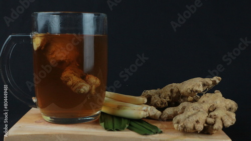 wedang jahe or ginger drink is traditional drink from Indonesia. Dark background photo