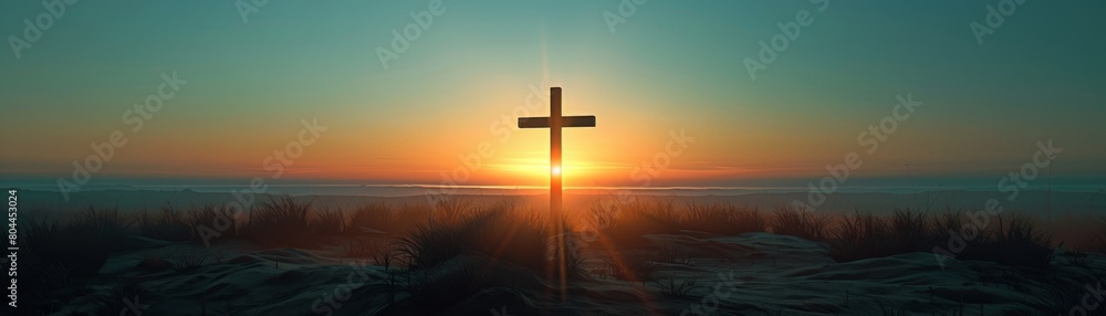 Serene sunset behind a cross in dunes, symbolizing peace and reflection
