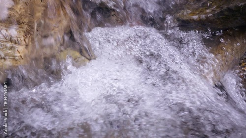 Fresh river water flowing from the mountain. Close up of a pure aqua. A spring of freshness. 