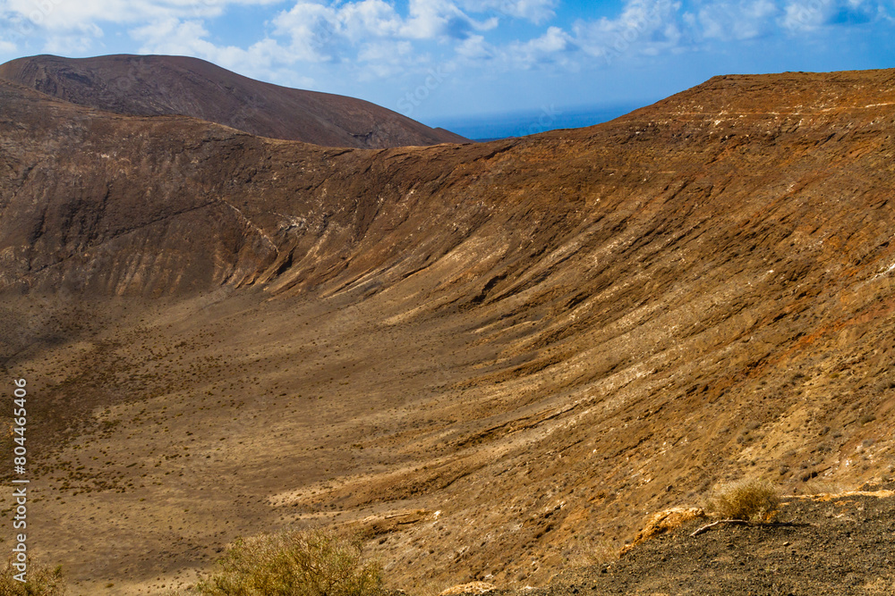 Hiking trail to Caldera Blanca. Interior the Caldera Blanca volcano. Los Volcanes Natural Park, Las Palmas, Lanzarote, Canary Islands, Spain