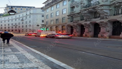 Portugal, Lisbon. Vibrant City Street Illuminated by Neon Lights at Night