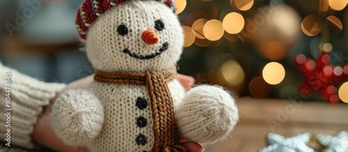 Wallpaper Mural Hand Holding Knitted Snowman by Christmas Tree Torontodigital.ca