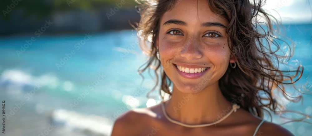 Confident Hispanic Woman Smiling by the Sea Confident Hispanic Woman Smiling by the Sea