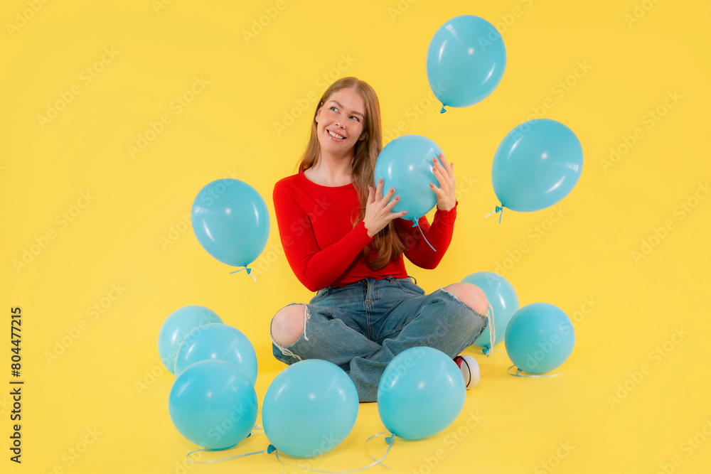 happy woman with balloons on yellow background happy woman with balloons on yellow background