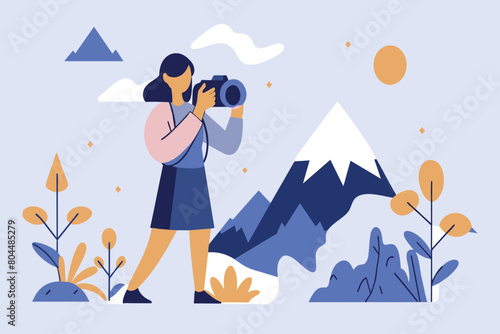 Woman takes photos of mountains at sunset