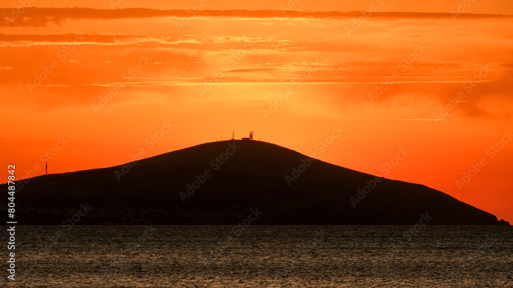 Bozcaada sunset in Aegean Island
from Geyikli neighborhood at Çanakkale city. Golden hours with sea and island at Bozcaada.