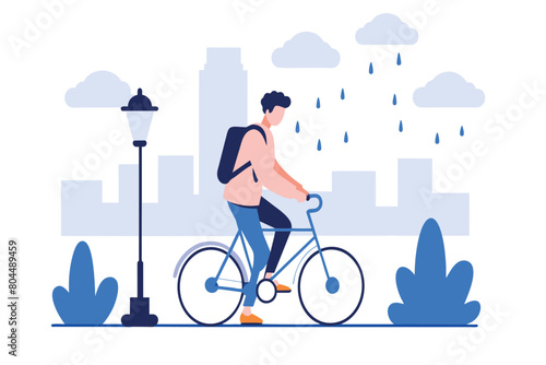 A cyclist pedals along a path near city skyline during a drizzle