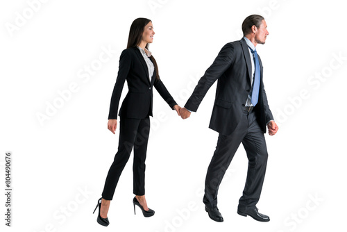Two professionals in business attire walking hand in hand, isolated on a white background, depicting partnership