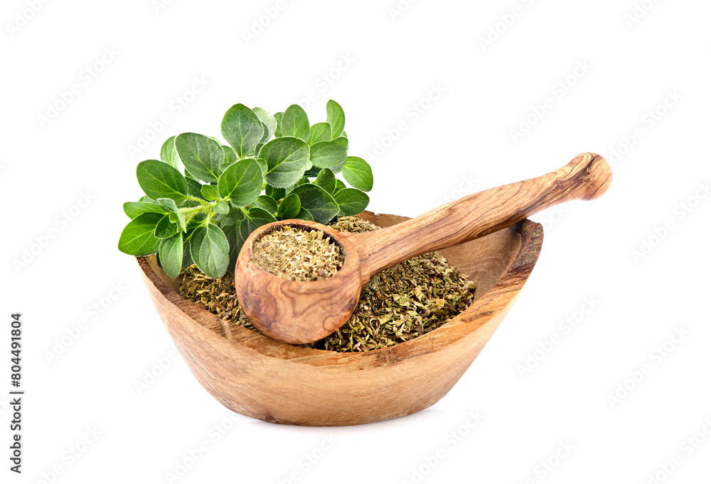 Oregano or marjoram leaves isolated on white background. Oregano fresh and dry in wooden bowl.