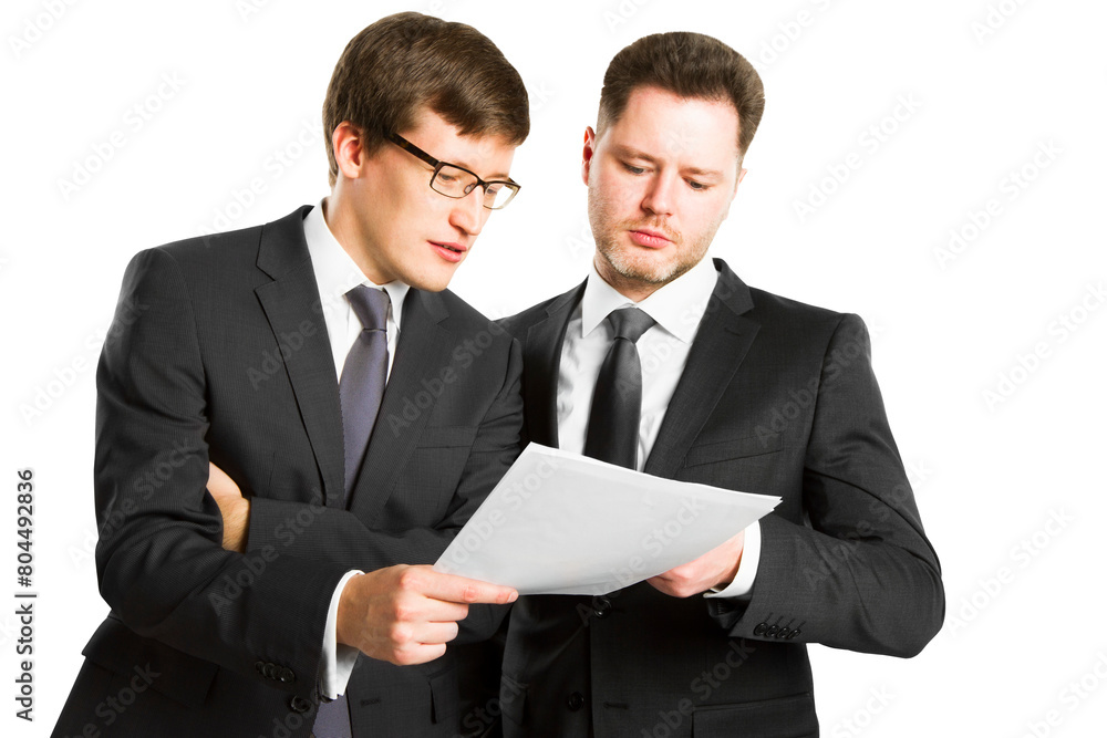 Two businessmen in suits discussing a document, isolated on a white background, concept of collaboration and business review Two businessmen in suits discussing a document, isolated on a white background, concept of collaboration and business review