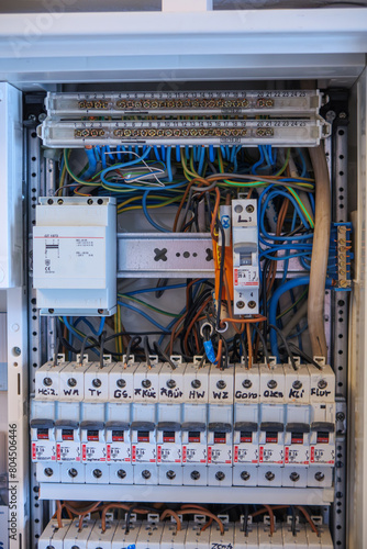 Obraz na płótnie An electrician works on a fuse box w salonie