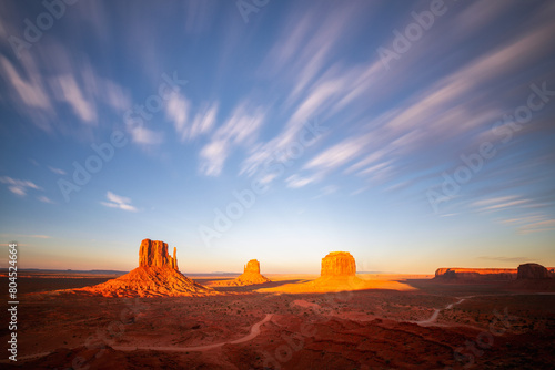 Famous view of  Monument Valley in American Southwest at sunset with beautiful clouds photo