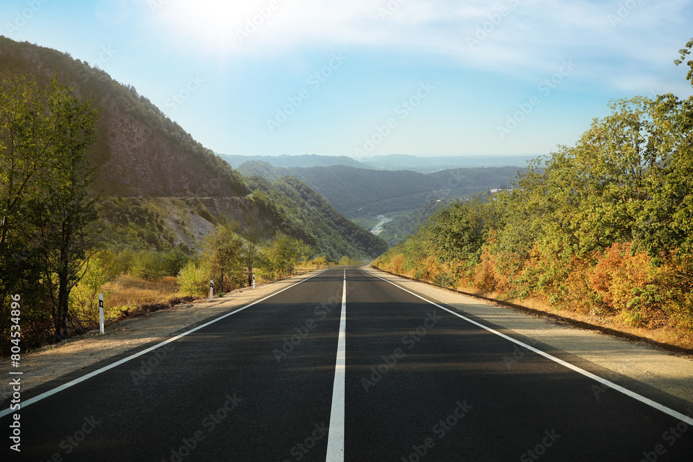 Empty asphalt road in mountains. Picturesque landscape