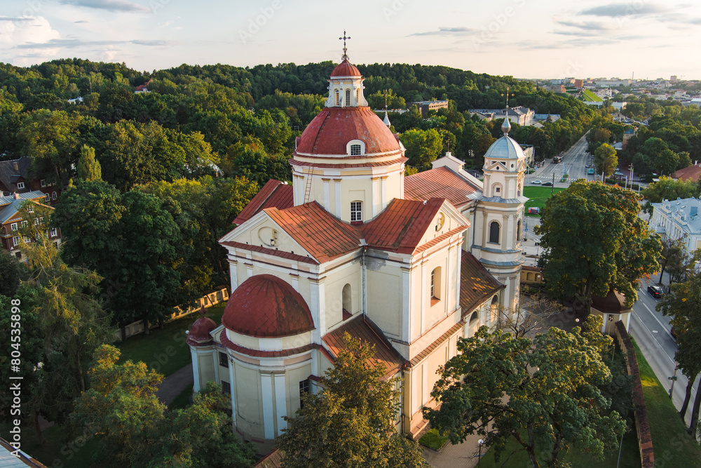 Aerial view of the Church of St. Peter and St. Paul, located in Antakalnis district in Vilnius. Beautiful summer day in the capital of Lithuania. Aerial view of the Church of St. Peter and St. Paul, located in Antakalnis district in Vilnius. Beautiful summer day in the capital of Lithuania.