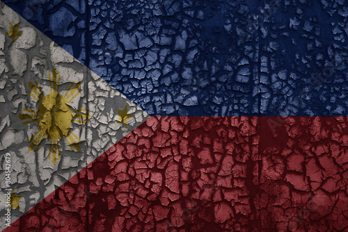 flag of philippines on a old grunge metal rusty cracked wall background
